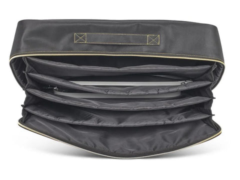 Black quilted tote bag with multiple interior compartments and a gold zipper.