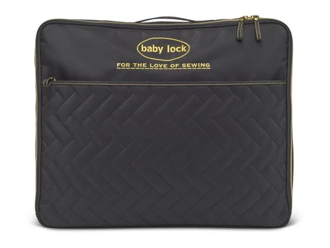 Black quilted tote bag with "baby lock" and "FOR THE LOVE OF SEWING" in gold.