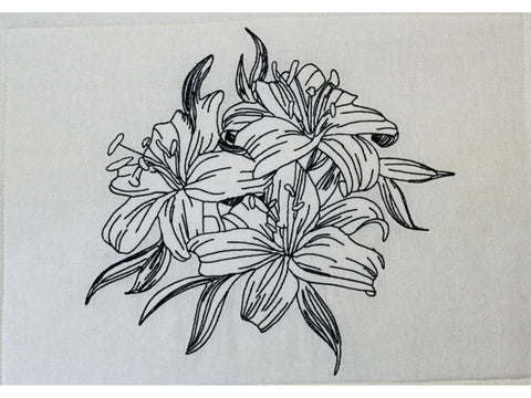 A white fabric swatch features a black outline embroidery of three lilies and leaves.