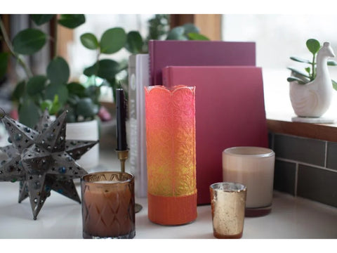 A decorative holiday collection of fills and motifs is displayed with candles and plants.