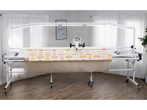A 10-foot light bar illuminates a quilting frame with a colorful quilt.
