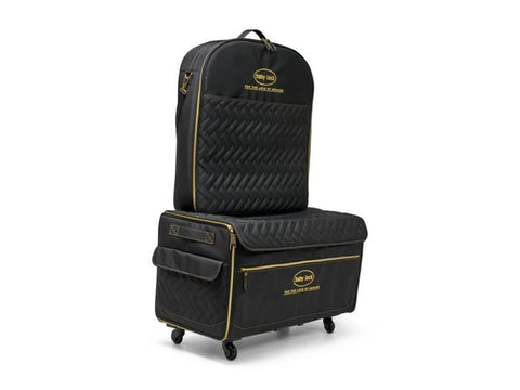 Baby Lock quilted black trolley with an embroidery arm case and gold accents.