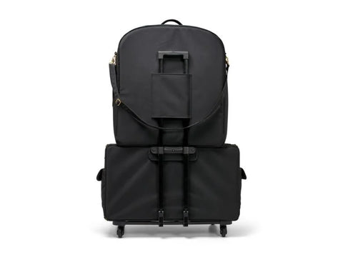 Black quilted trolley with an embroidery arm case and gold hardware.