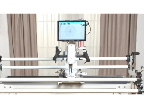 A Baby Lock ProStitcher 6 quilting robotics system with a tablet displaying a circular pattern.