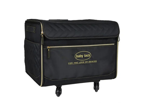 Large black quilted Baby Lock serger trolley with gold zippers and wheels.