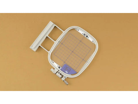 IQ Intuition Positioning Embroidery Hoop and Grid (4" x 4") on a tan background.