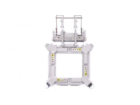 A white 4x4 inch magnetic embroidery frame with a metal frame holder.