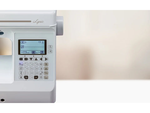 A white Baby Lock Lyric sewing and quilting machine with a digital display.