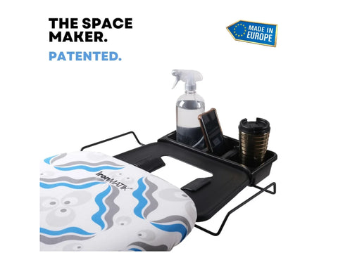 Ironing board with a blue and gray patterned cover and a black accessory tray.