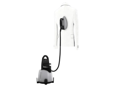 A Laurastar Lift Xtra Steam Iron steaming a white jacket on a hanger.