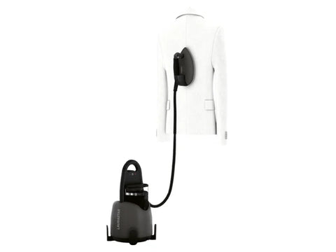 A Laurastar Lift Xtra Steam Iron in titan gray is connected to a white jacket on a hanger.
