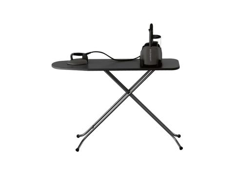 A black Laurastar Lift Xtra steam iron and ironing board.