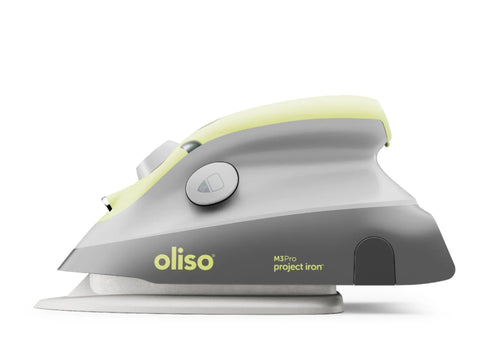 Oliso M3Pro Project Iron in pistachio, shown from the side.