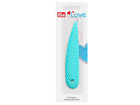 Turquoise Prym Love Point Turner with white polka dots in clear packaging.
