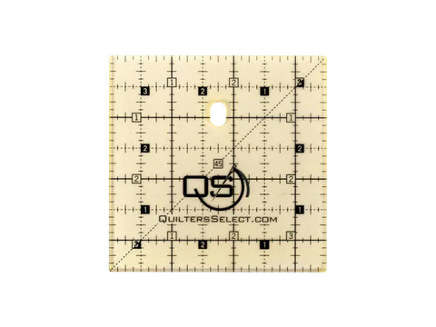 A 3.5 by 3.5 inch Quilters Select non-slip quilting ruler with grid lines and numbers.
