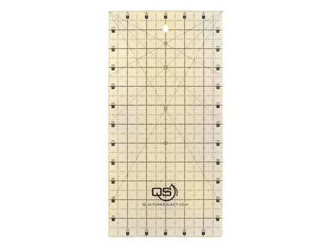 A clear, rectangular quilting ruler with black grid lines and a non-slip coating.