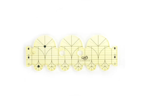 A yellow transparent Quilters Select Diameter Arc Ruler with black markings.