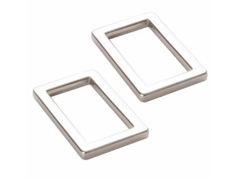 Two nickel-colored 1-inch rectangular rings are shown on a white background.