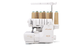 A white Baby Lock Accolade serger with eight spools of tan thread.