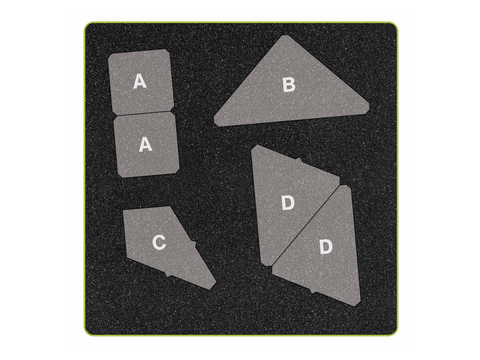 A gray foam cutting die with various labeled shapes for quilting.
