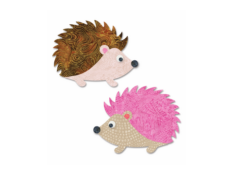 Two fabric hedgehogs, one brown and one pink, face right on a white background.