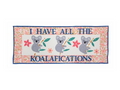 A rectangular quilt features three koalas and the phrase "I HAVE ALL THE KOALAFICATIONS".