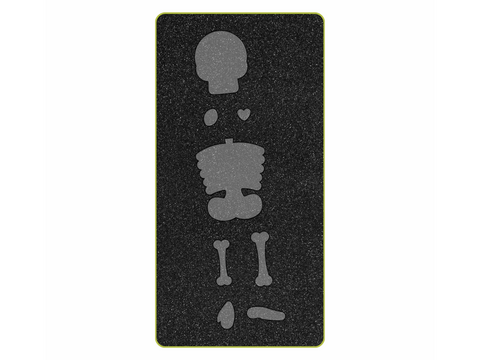 A black cutting die features eight gray skeleton shapes, including a skull, rib cage, and bones.