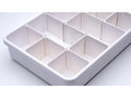 White plastic notions tray with 15 compartments.