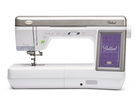A white and silver Baby Lock Ballad sewing and quilting machine.