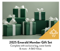 A collection of dark green gift boxes with white ribbons and bows.