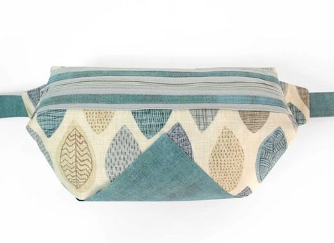 Gray Emily Tote with a leaf pattern and a teal accent.