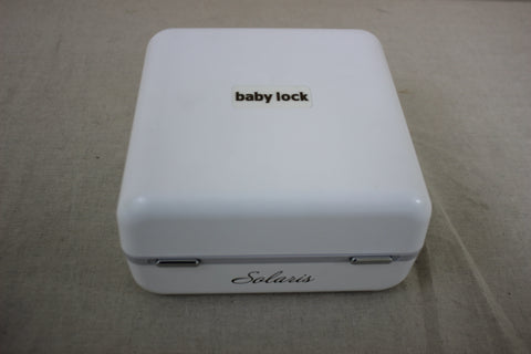 A white Baby Lock Solaris sewing and embroidery machine is shown from above.