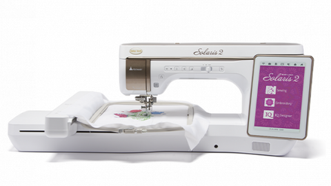 A white Baby Lock Solaris 2 sewing and embroidery machine with a digital display.
