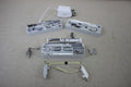 A collection of sewing machine accessories, including presser feet and tools, in various cases.