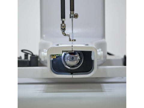 Close-up of a sewing machine needle and bobbin area.