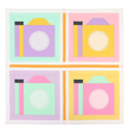 A quilt kit featuring four pastel camera blocks with white borders and orange sashing.