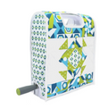 A quilted fabric cover for a fabric cutter, featuring blue, green, and white geometric patterns.