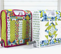 Two fabric cutter covers, one with colorful geometric patterns and the other with blue and green designs.