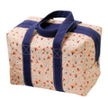 Pink floral insulated lunchbox tote with navy straps.