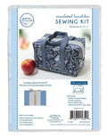 A sewing kit for an insulated lunchbox tote with a blue floral pattern and a red apple.