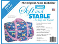 White By Annie Soft & Stable foam stabilizer, 72 by 58 inches, with a blue butterfly duffle bag.