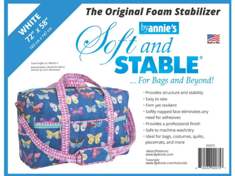 White By Annie Soft & Stable foam stabilizer, 72 by 58 inches, with a blue butterfly duffle bag.