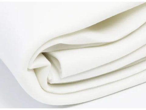 White By Annie Soft & Stable fabric, folded and stacked.