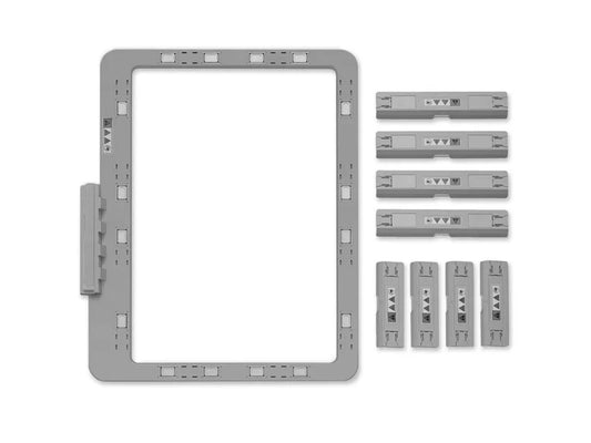 A gray Baby Lock magnetic frame, 7 x 12 inches, with four long and four short magnetic inserts.